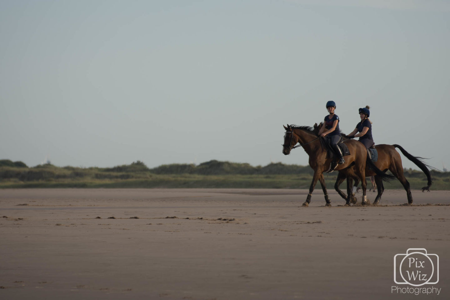 Horse riders on the beach